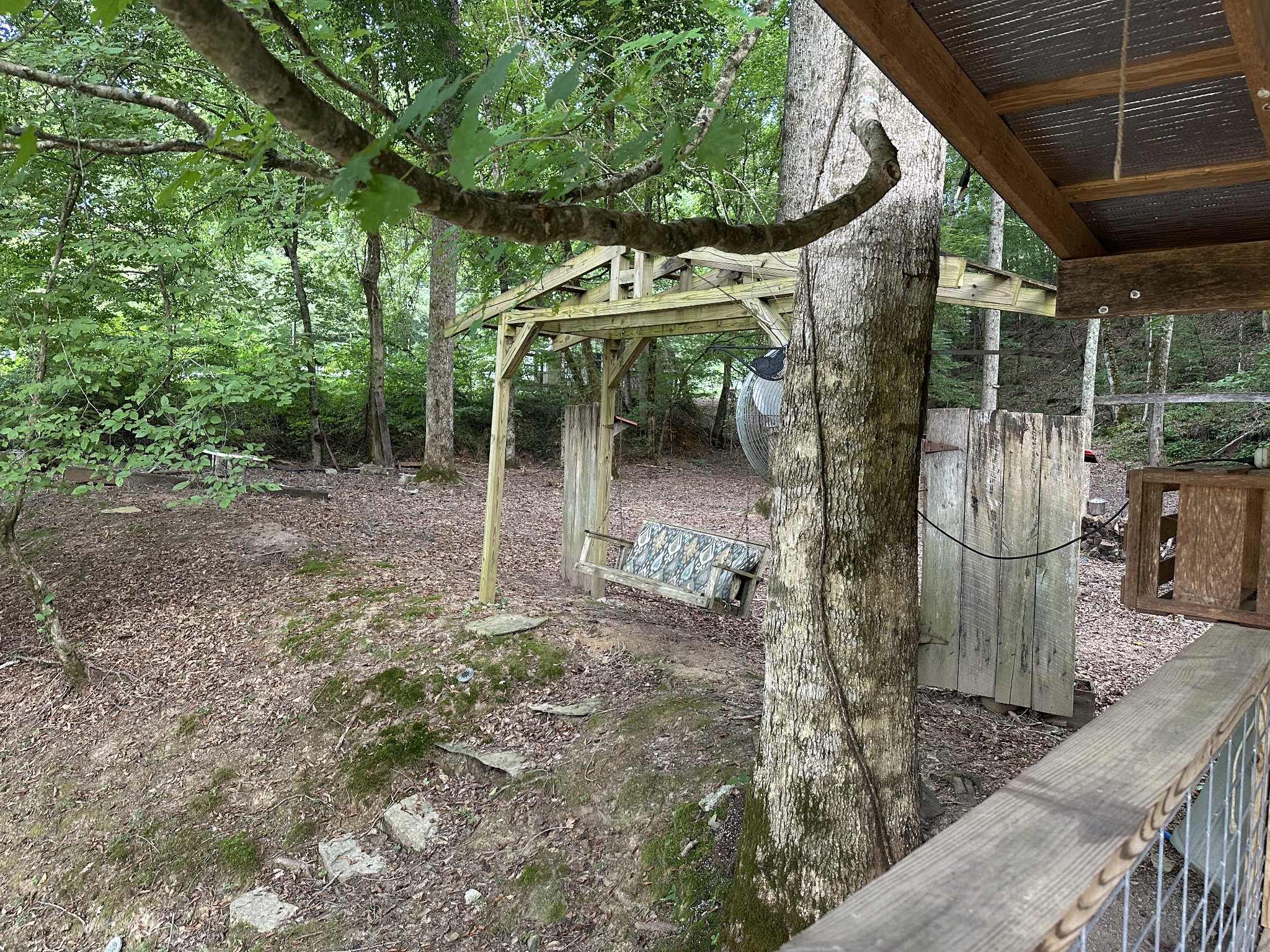 104 Limo View Lane Hohenwald, TN 38462 - Photo 55 of 67 a backyard of a house with seating space