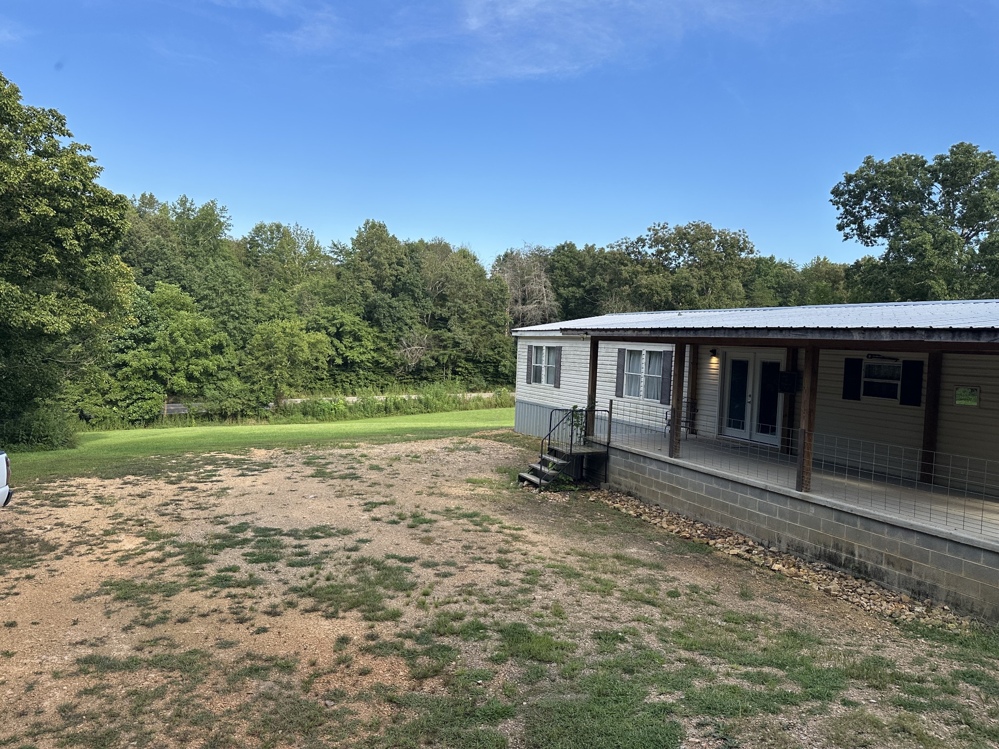 104 Limo View Lane Hohenwald, TN 38462 - Photo 6 of 67 a view of a house with a yard