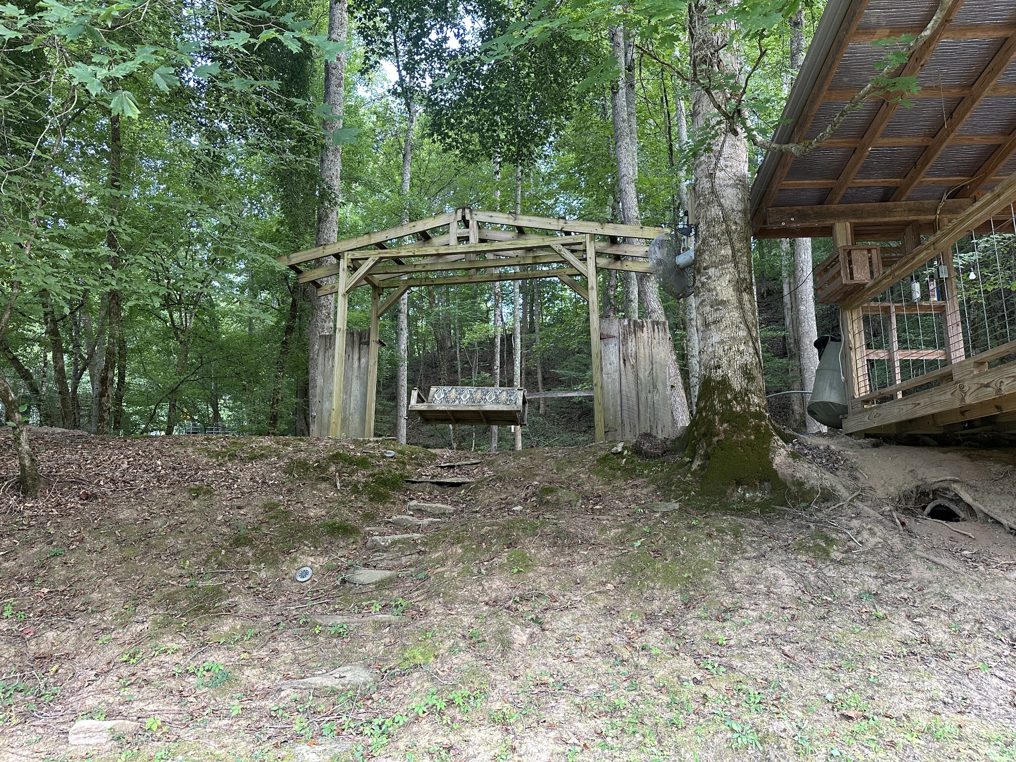 104 Limo View Lane Hohenwald, TN 38462 - Photo 63 of 67 a view of a wooden house with a yard