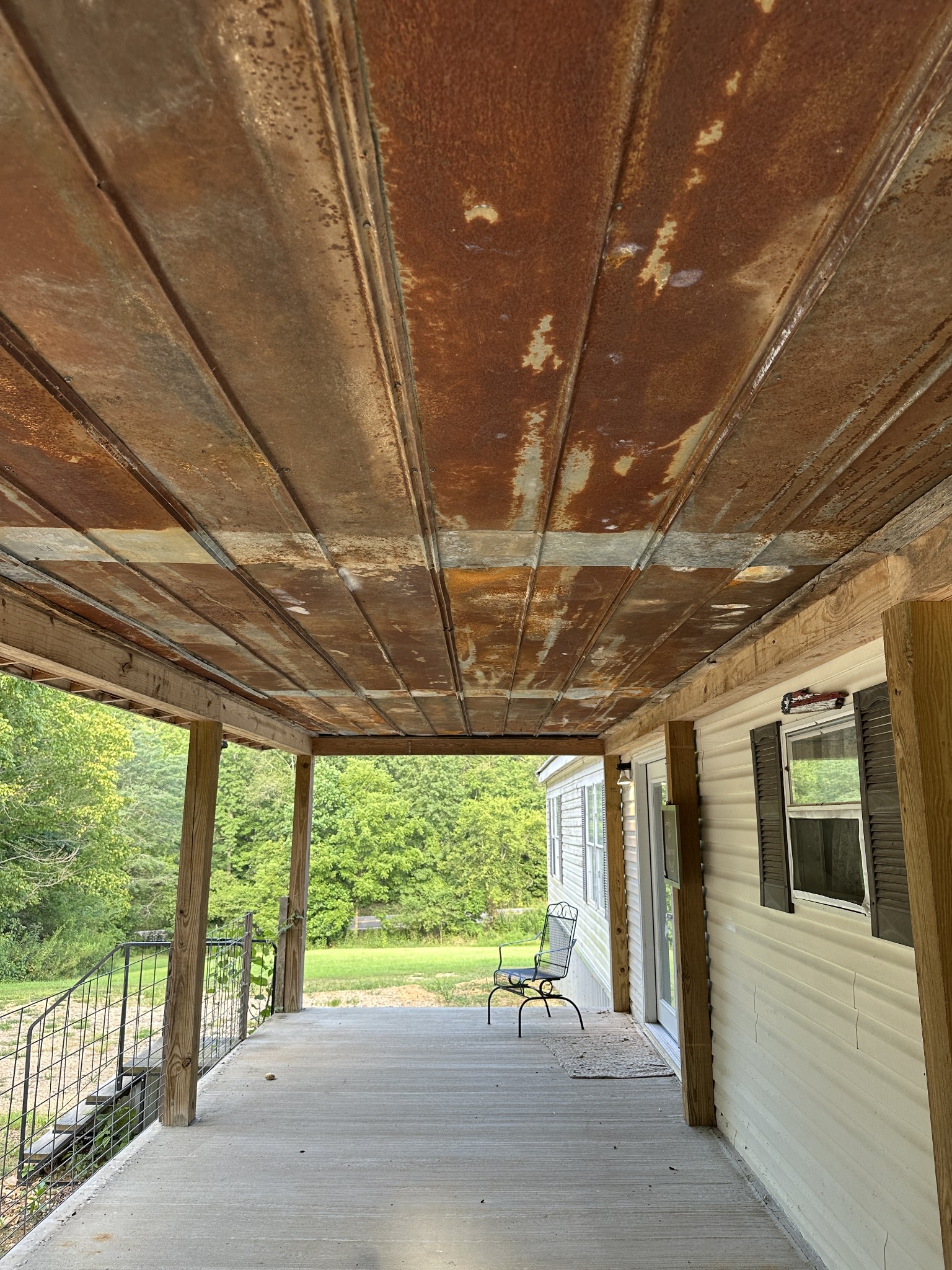 104 Limo View Lane Hohenwald, TN 38462 - Photo 8 of 67 a view of a porch with furniture and a backyard