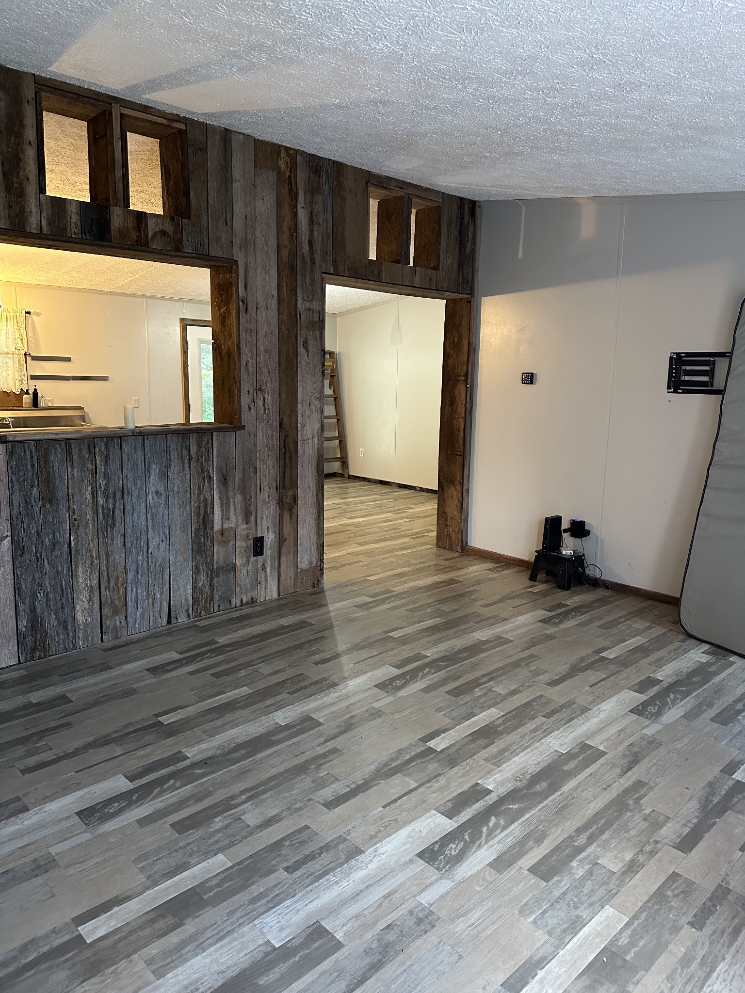 104 Limo View Lane Hohenwald, TN 38462 - Photo 9 of 67 a view of a room with wooden floor and stairs