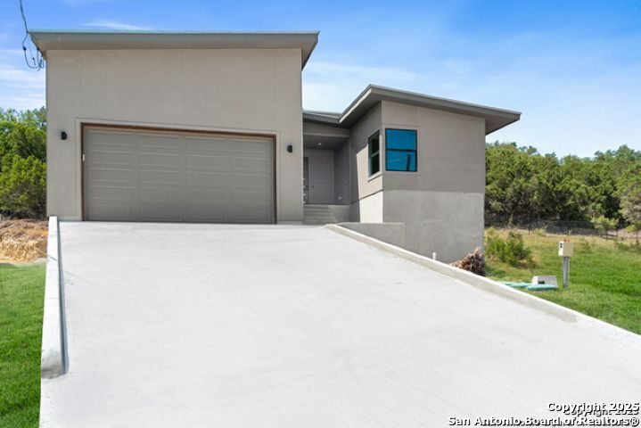 1381 Overbrook Lane Spring Branch, TX 78070 - Photo 1 of 1 a house with a outdoor space