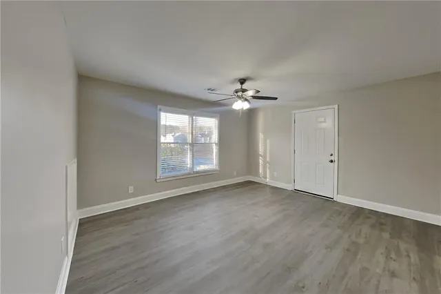 a view of an empty room with a window