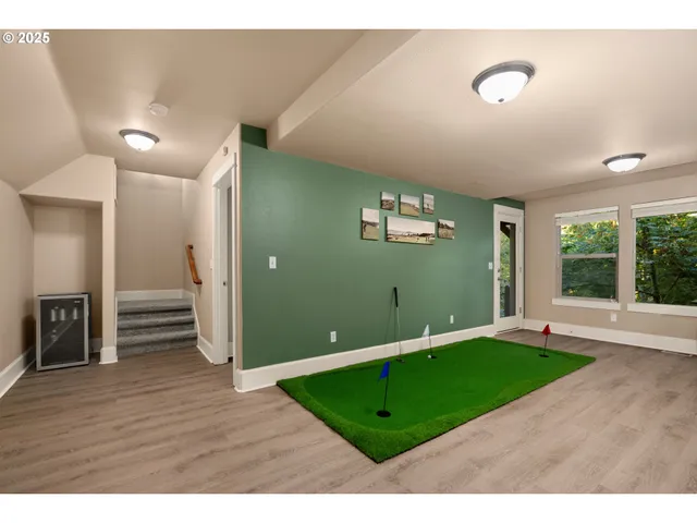 a view of a room window and wooden floor