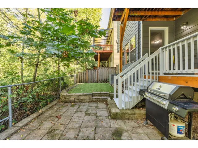 a view of a porch with furniture and garden