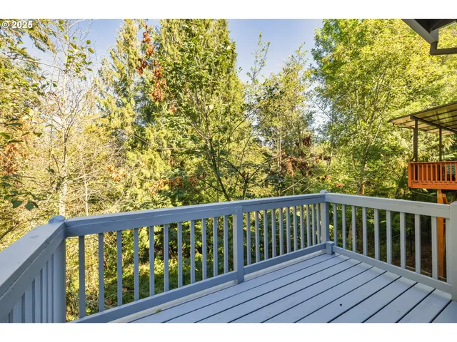 a view of balcony with wooden floor