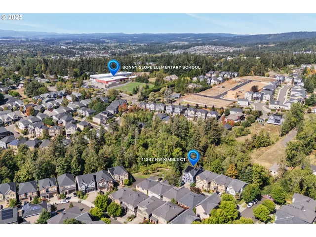 an aerial view of a city with lots of residential buildings