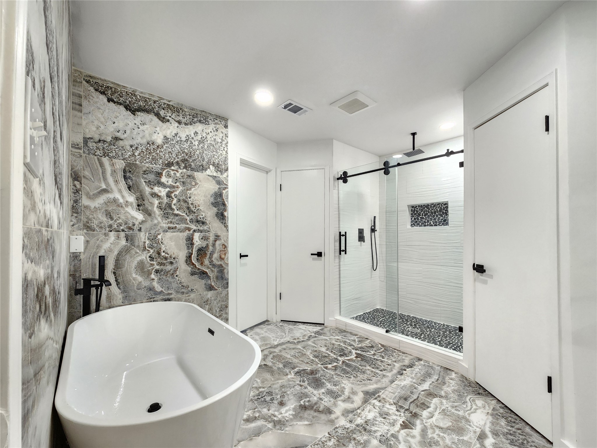 5411 Cobble Lane Spring, TX 77379 - Photo 21 of 31 a bathroom with a bathtub and shower