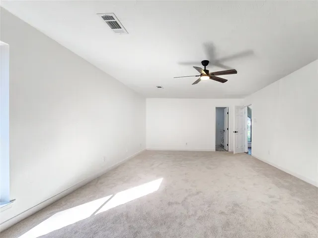 a kitchen with a refrigerator and a sink