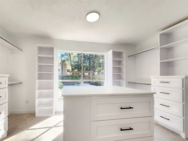 a view of cabinets and window