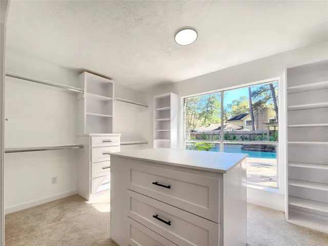 a kitchen with a refrigerator and a sink