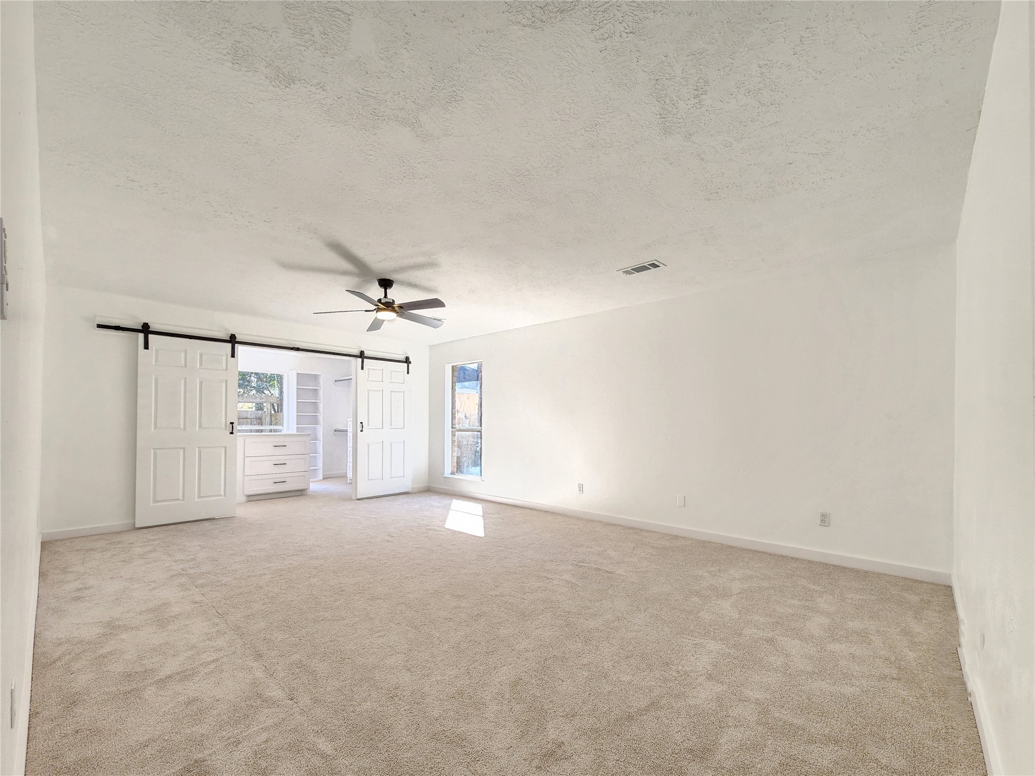 5411 Cobble Lane Spring, TX 77379 - Photo 26 of 31 an empty room with windows and fan