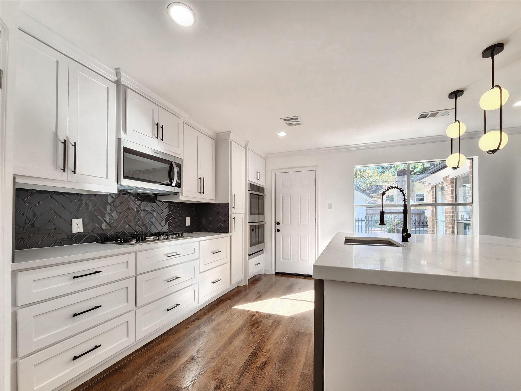 5411 Cobble Lane Spring, TX 77379 - Photo 30 of 31 a kitchen with white cabinets and sink