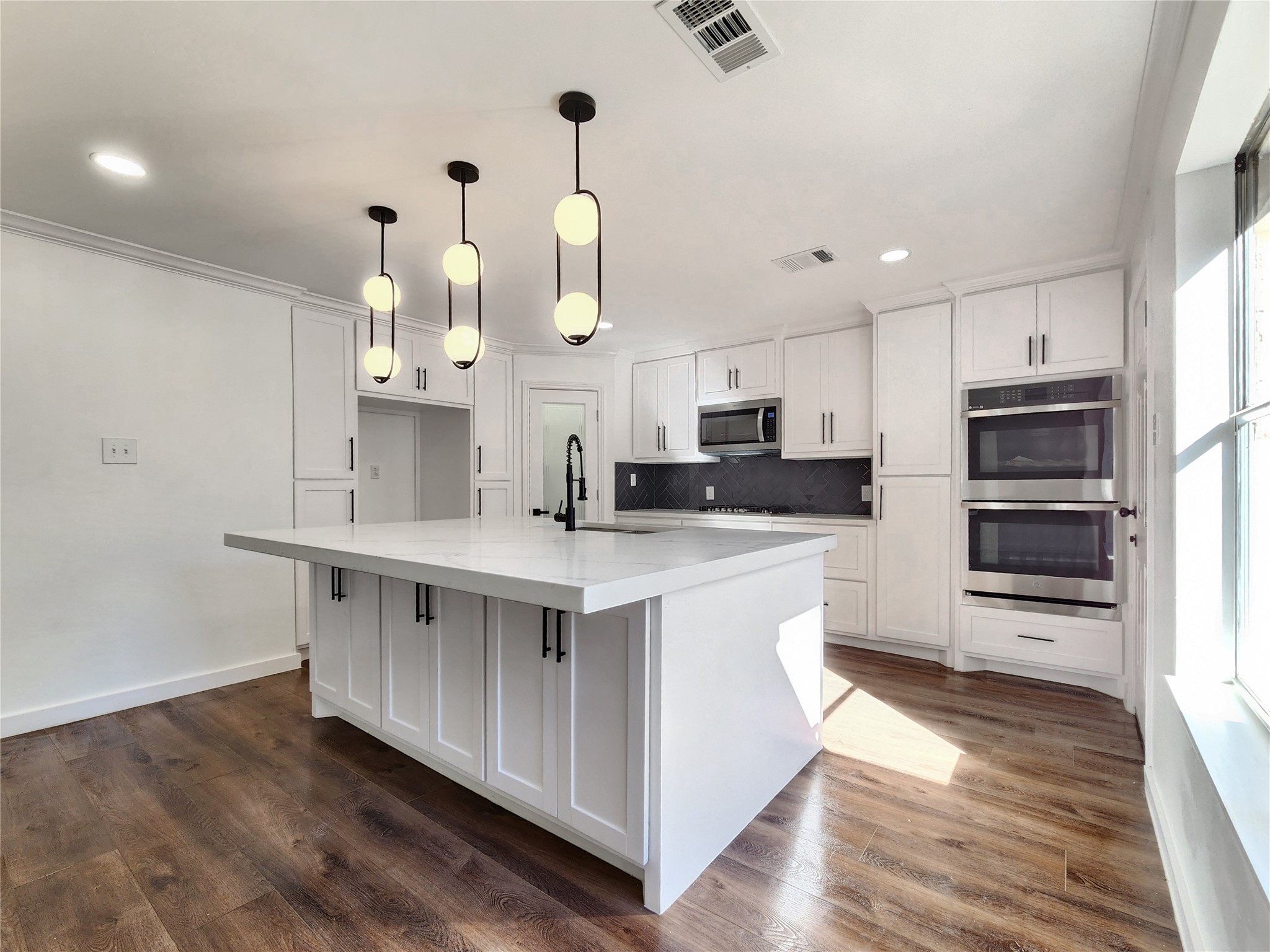 5411 Cobble Lane Spring, TX 77379 - Photo 31 of 31 a kitchen with kitchen island granite countertop a sink cabinets and stainless steel appliances