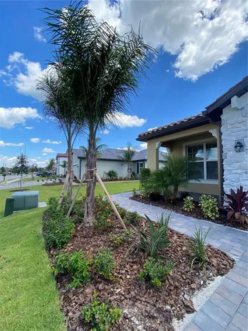a view of a garden with a house