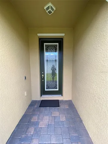a view of a hallway with a outdoor space