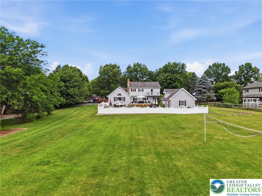 890 Lahr Road Nazareth, PA 18064 - Photo 69 of 71 A spacious yard offers ample room for recreation, extending from the house with its charming rear deck.