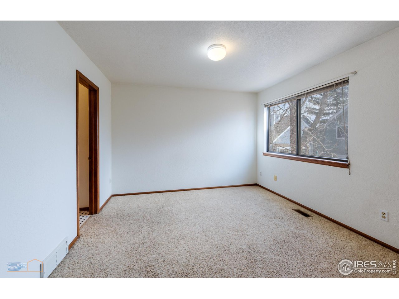 3076 Fulton Circle Boulder, CO 80301 - Photo 12 of 29 a view of an empty room with a window