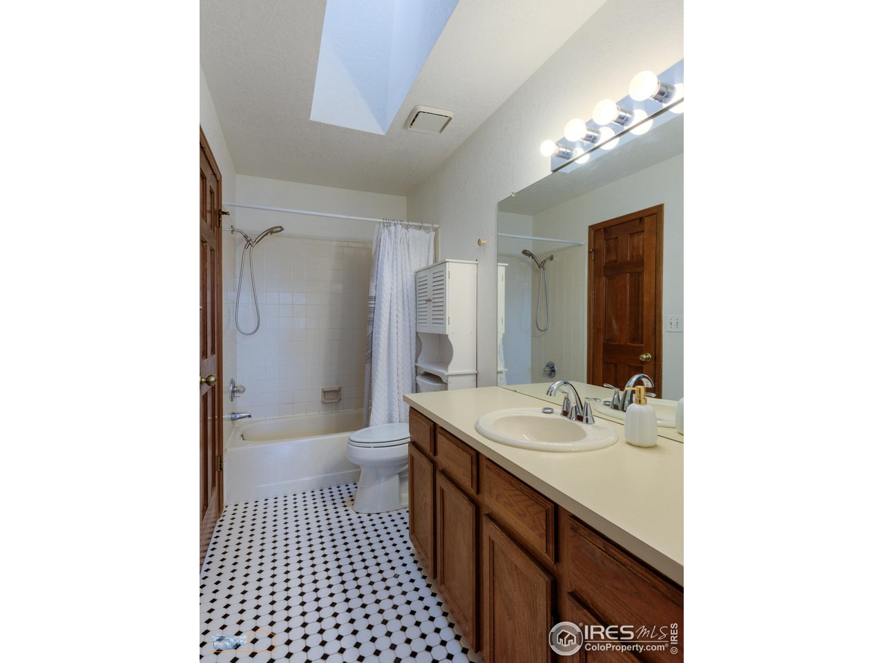 3076 Fulton Circle Boulder, CO 80301 - Photo 14 of 29 a bathroom with a sink a toilet and a mirror