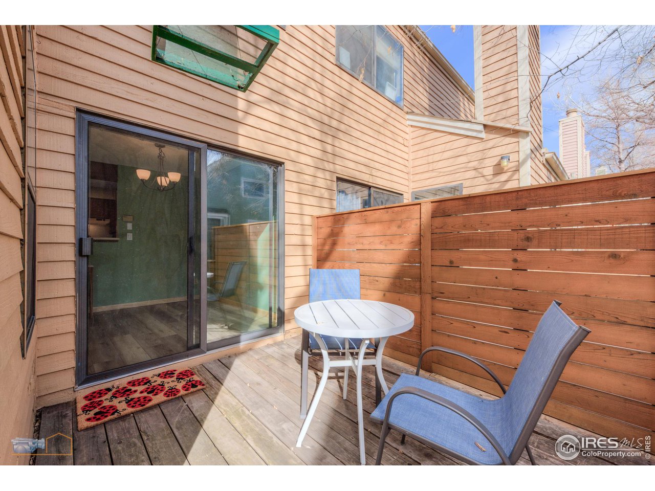 3076 Fulton Circle Boulder, CO 80301 - Photo 21 of 29 a backyard of a house with table and chairs