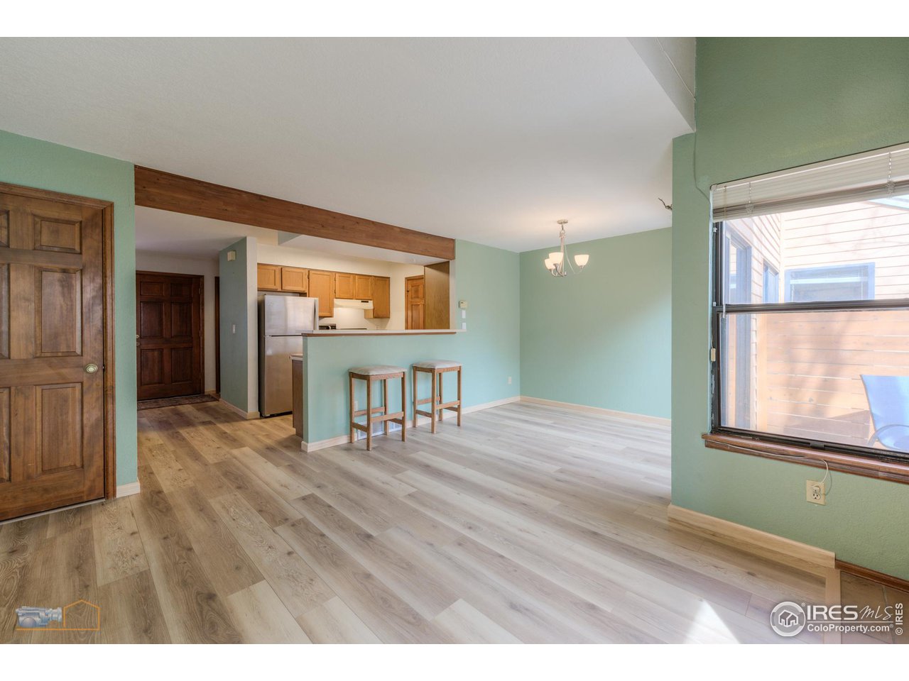 3076 Fulton Circle Boulder, CO 80301 - Photo 28 of 29 a view of an empty room with wooden floor and a window