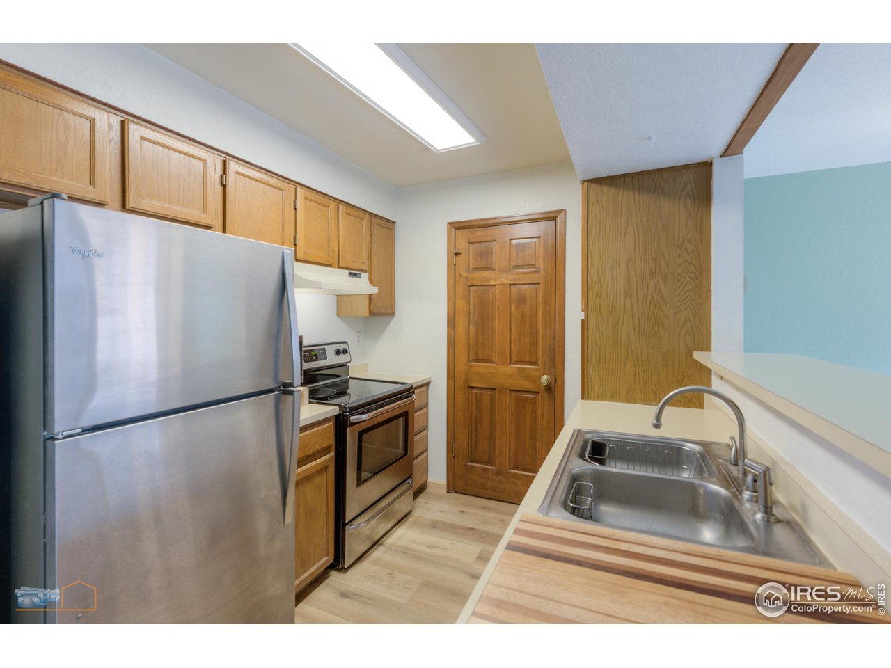 3076 Fulton Circle Boulder, CO 80301 - Photo 7 of 29 a kitchen with granite countertop a refrigerator and a sink