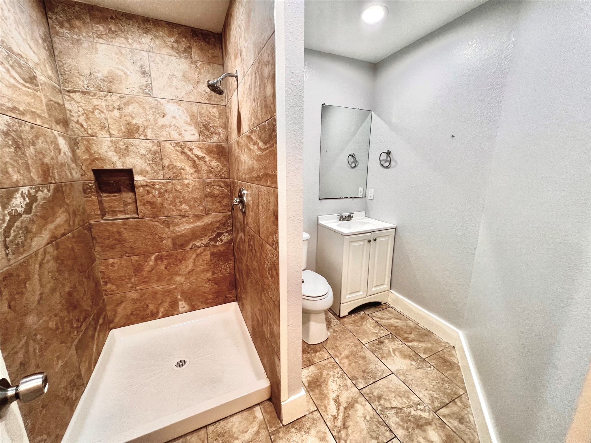 914 Bunton Street Houston, TX 77009 - Photo 14 of 15 a bathroom with a sink a toilet and shower