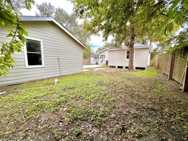 a house view with a backyard space