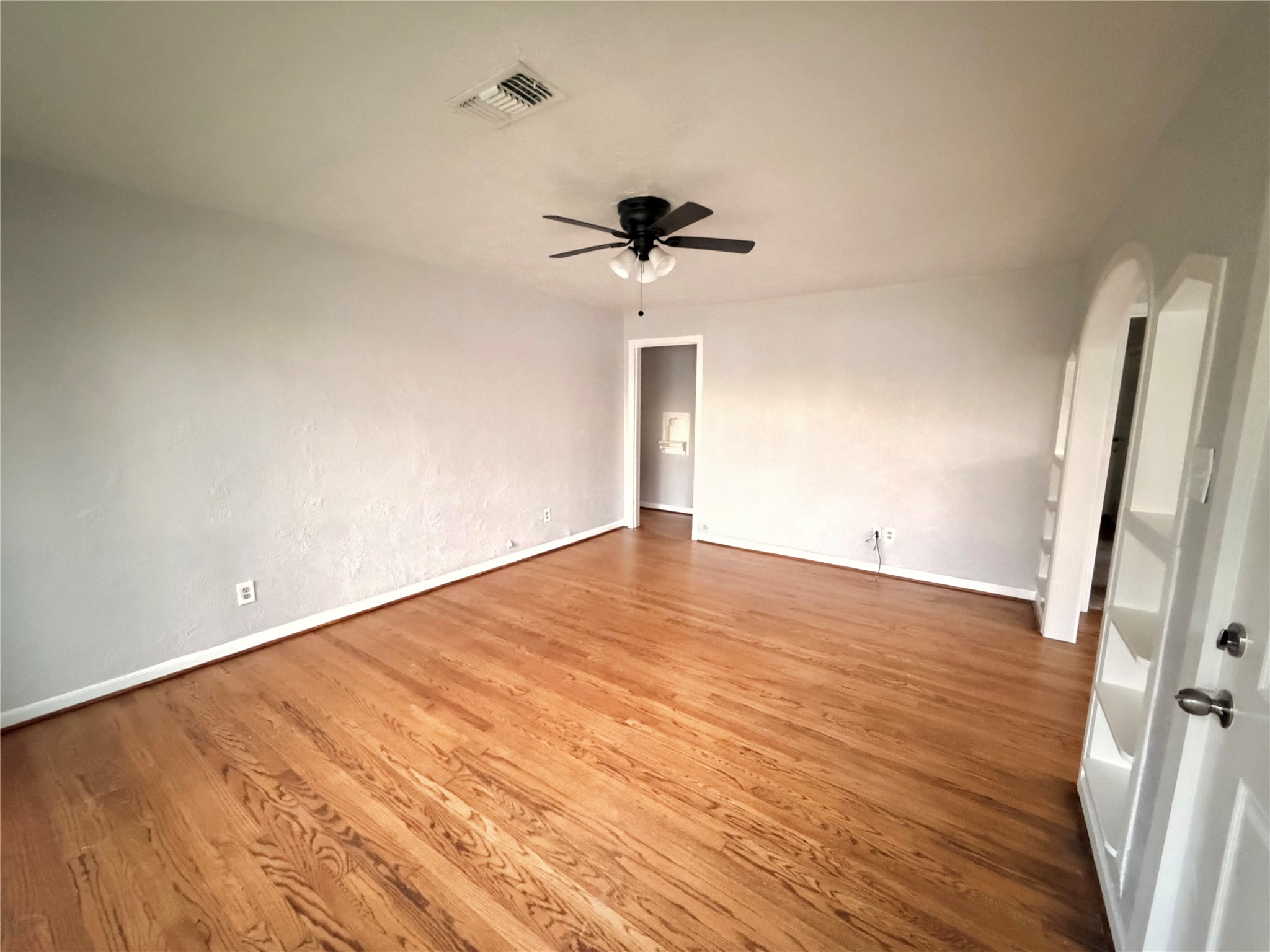 914 Bunton Street Houston, TX 77009 - Photo 4 of 15 a view of empty room with wooden floor