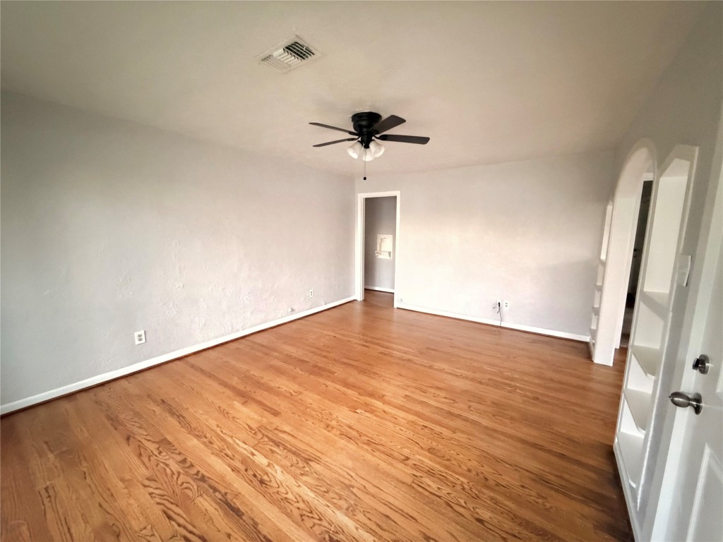 914 Bunton Street Houston, TX 77009 - Photo 4 of 15 a view of empty room with wooden floor