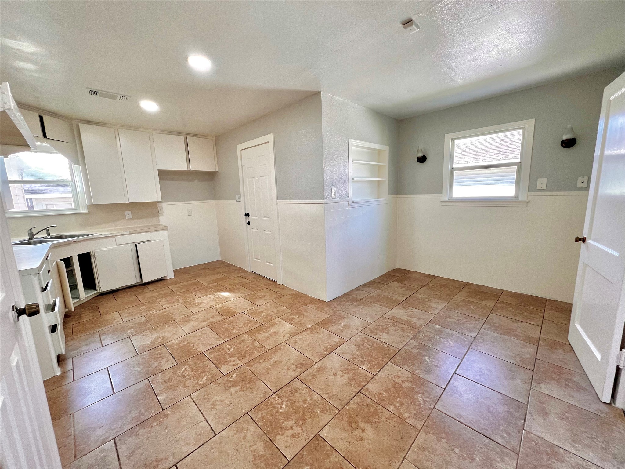 914 Bunton Street Houston, TX 77009 - Photo 7 of 15 a view of a kitchen with furniture and a window