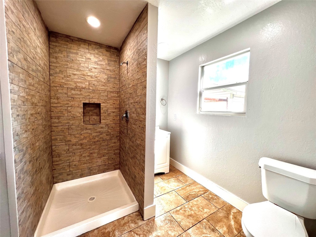914 Bunton Street Houston, TX 77009 - Photo 10 of 15 a bathroom with a toilet and a shower