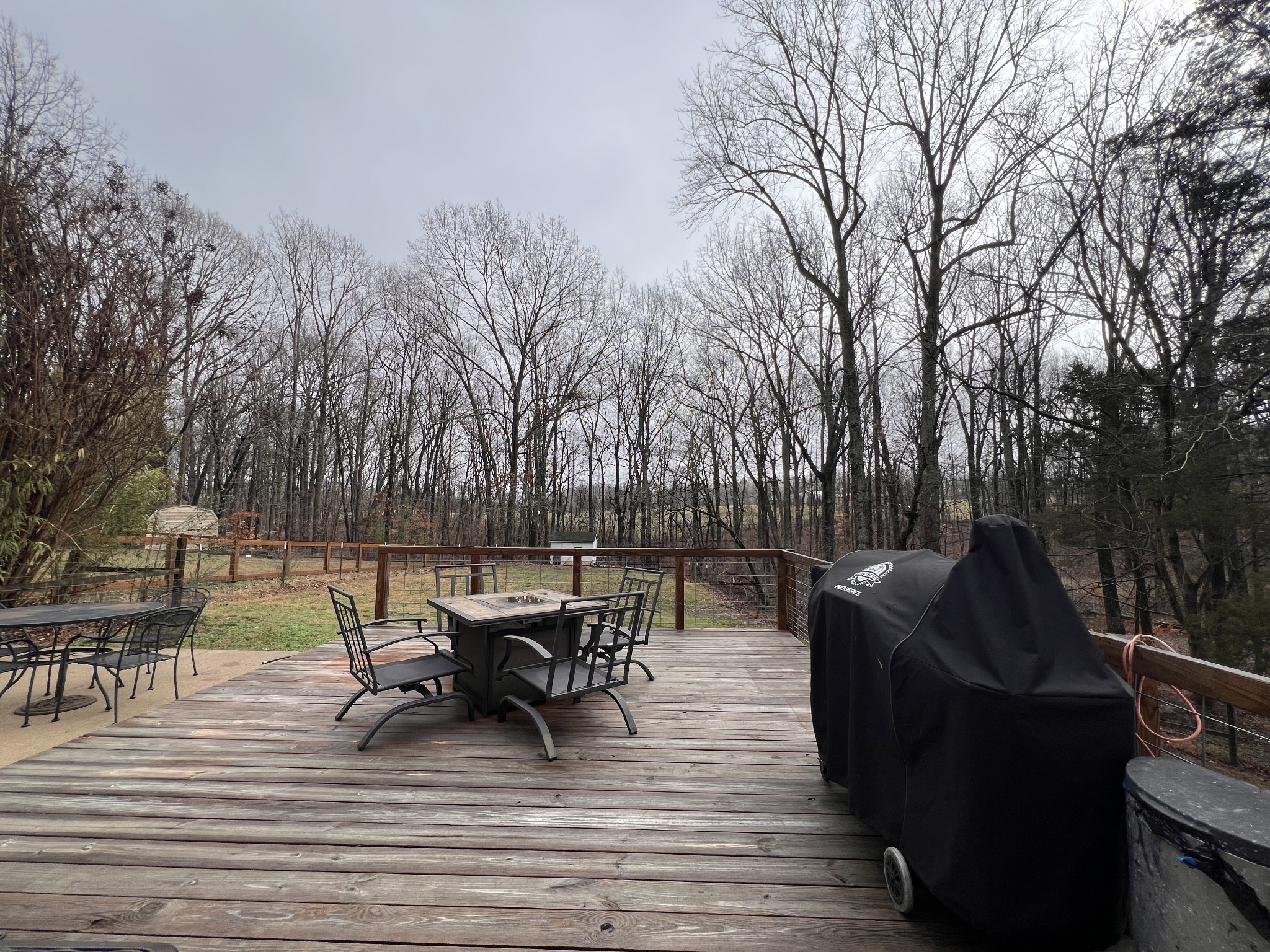 2001 Cherokee Trail Springfield, TN 37172 - Photo 18 of 22 a view of a patio with dining table and chairs with wooden floor and fence