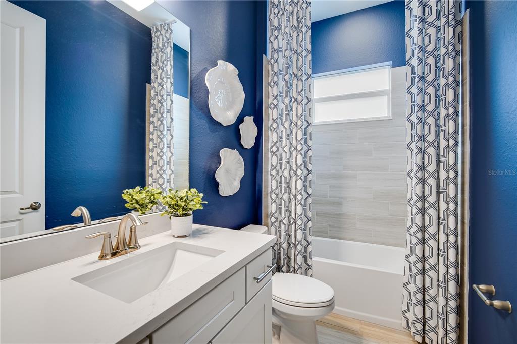 7165 Inlet Isles Lakewood Ranch, FL 34202 - Photo 21 of 26 a bathroom with a sink mirror vanity and toilet