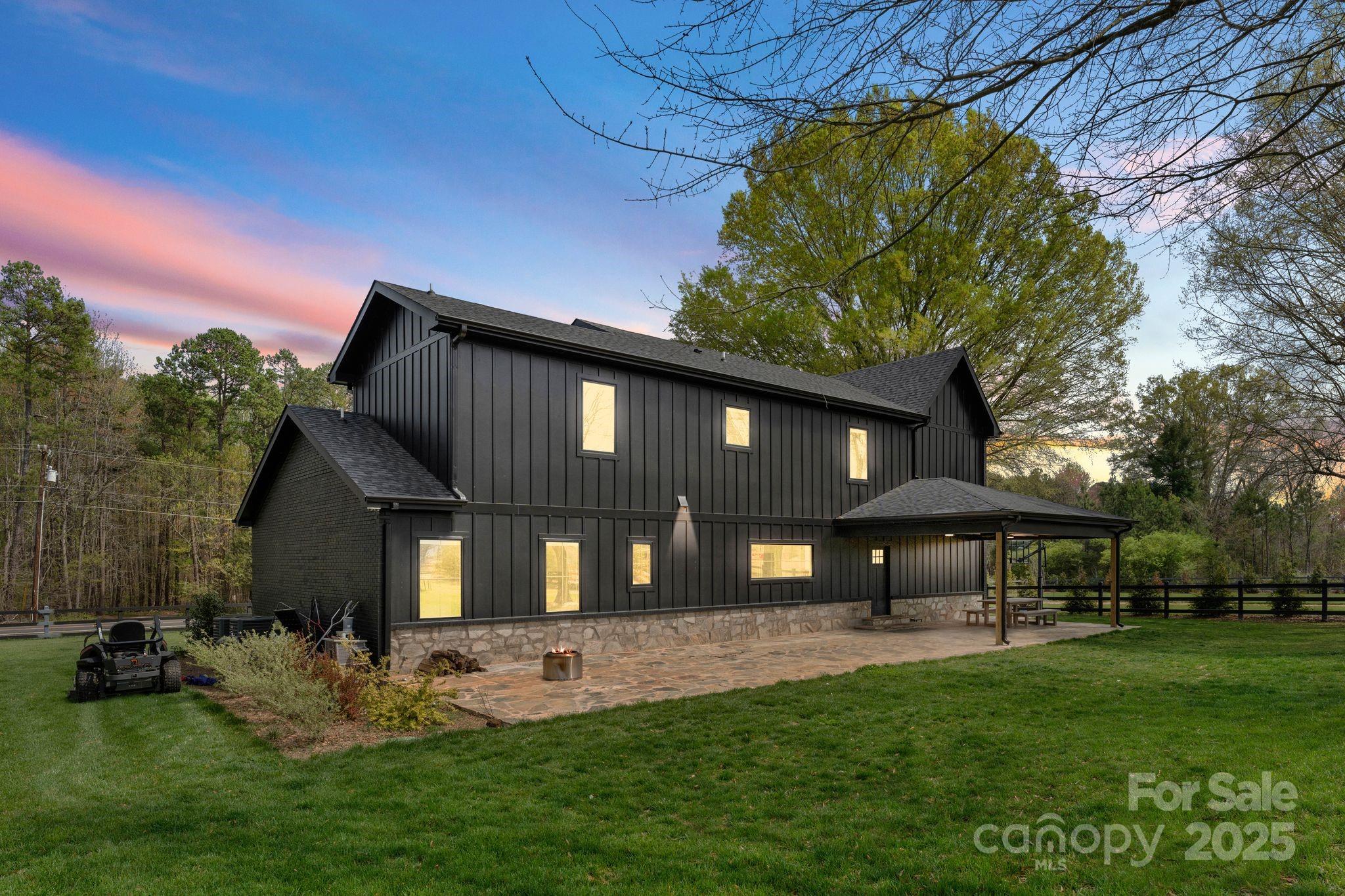 1575 Shinnville Road Cleveland, NC 27013 - Photo 2 of 47 a front view of a house with a garden