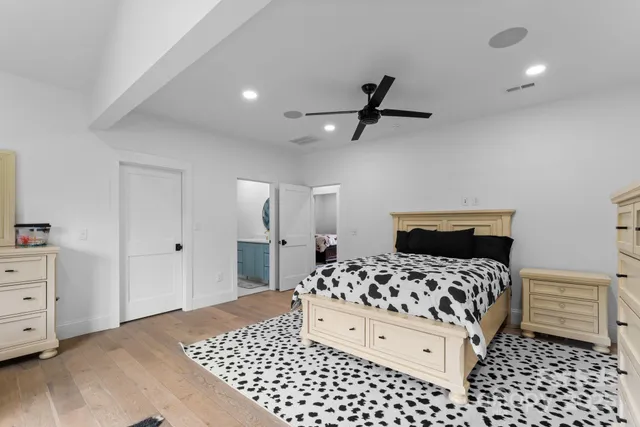 a bedroom with a bed and a dresser