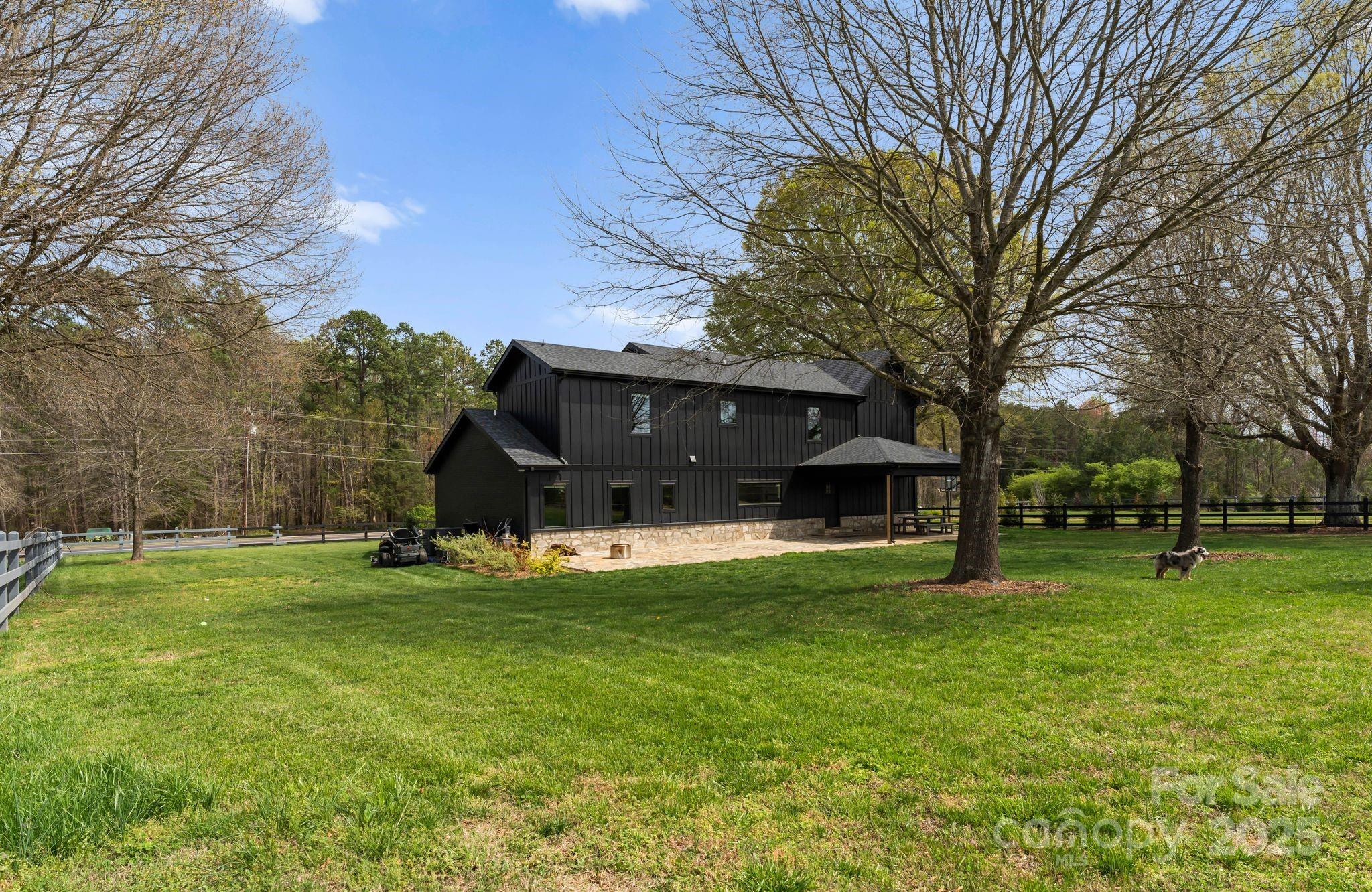 1575 Shinnville Road Cleveland, NC 27013 - Photo 45 of 47 a view of a house with a big yard and a large tree