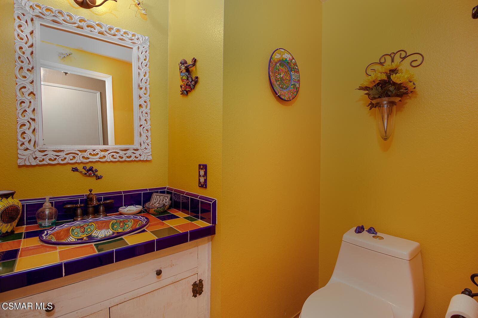 13339 Peach Hill Road Moorpark, CA 93021 - Photo 18 of 45 a bathroom with a sink and a mirror