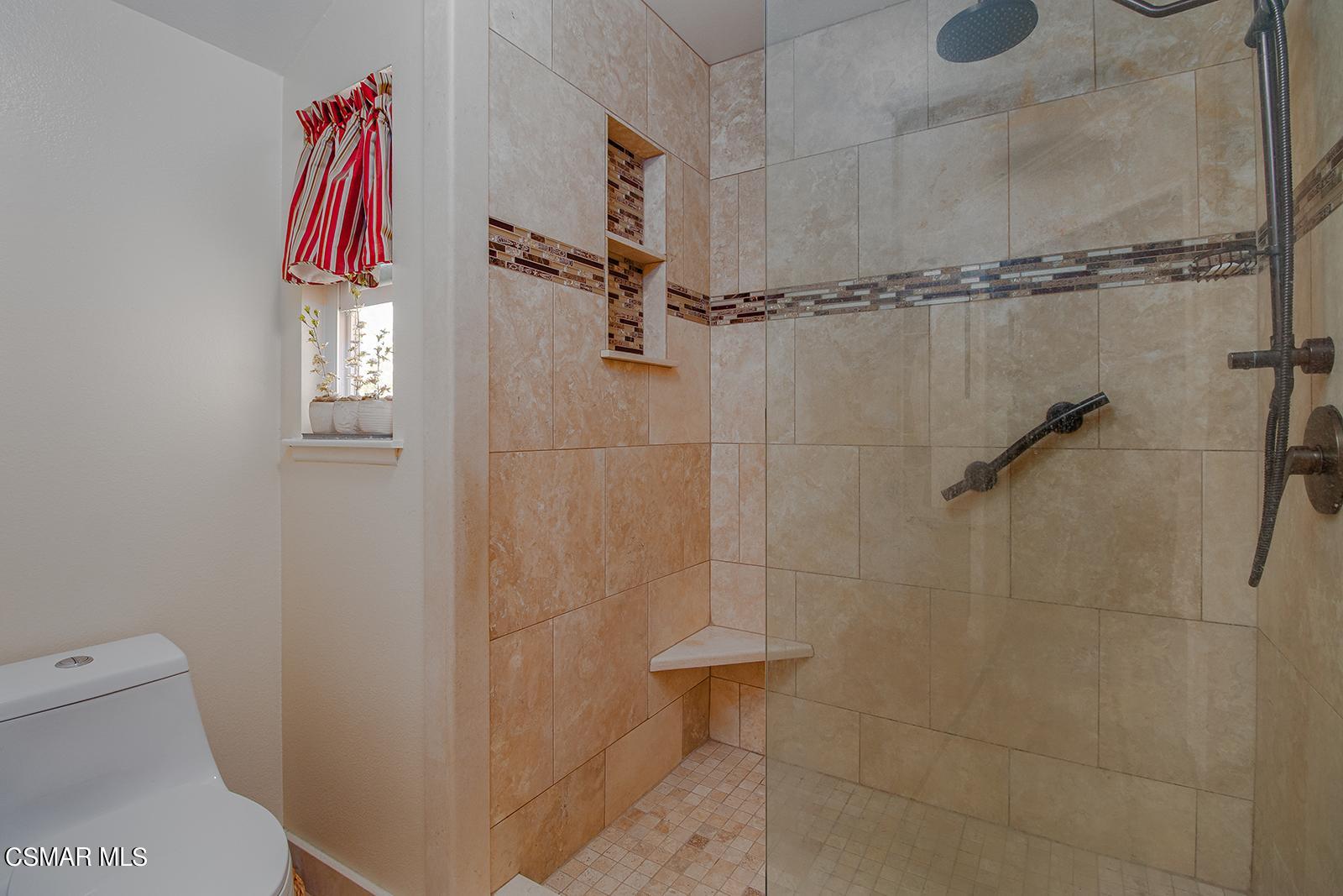 13339 Peach Hill Road Moorpark, CA 93021 - Photo 28 of 45 a bathroom with a shower and a toilet