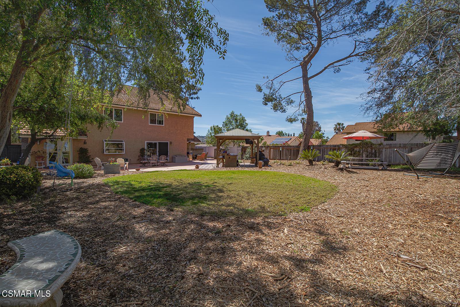 13339 Peach Hill Road Moorpark, CA 93021 - Photo 33 of 45 a view of a yard with a house