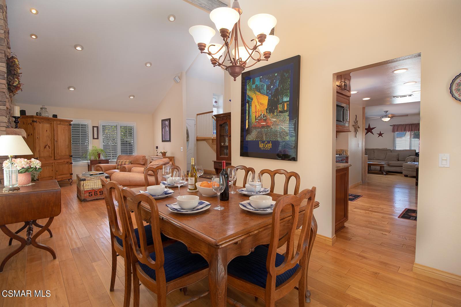 13339 Peach Hill Road Moorpark, CA 93021 - Photo 8 of 45 a view of a dining room with furniture and wooden floor