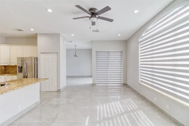 a view of a kitchen with a sink and a window