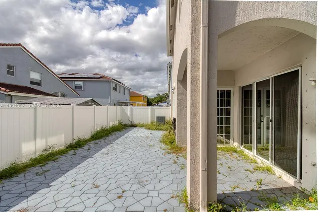 a view of a swimming pool with a lounge chairs