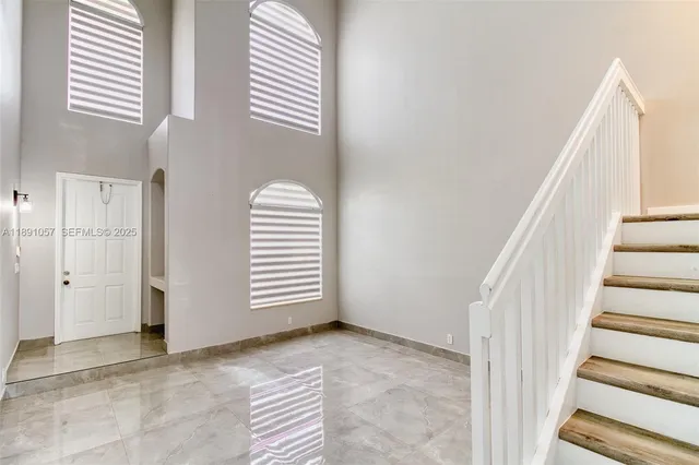 a view of a livingroom with stairs