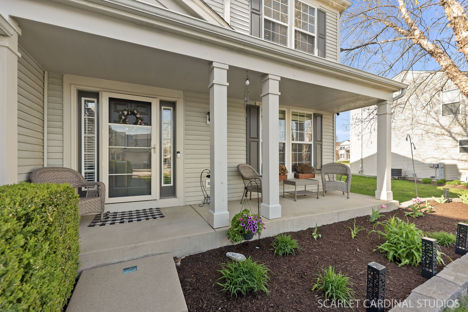 11748 Glenn Circle Plainfield, IL 60585 - Photo 2 of 24 a front view of a house with a porch