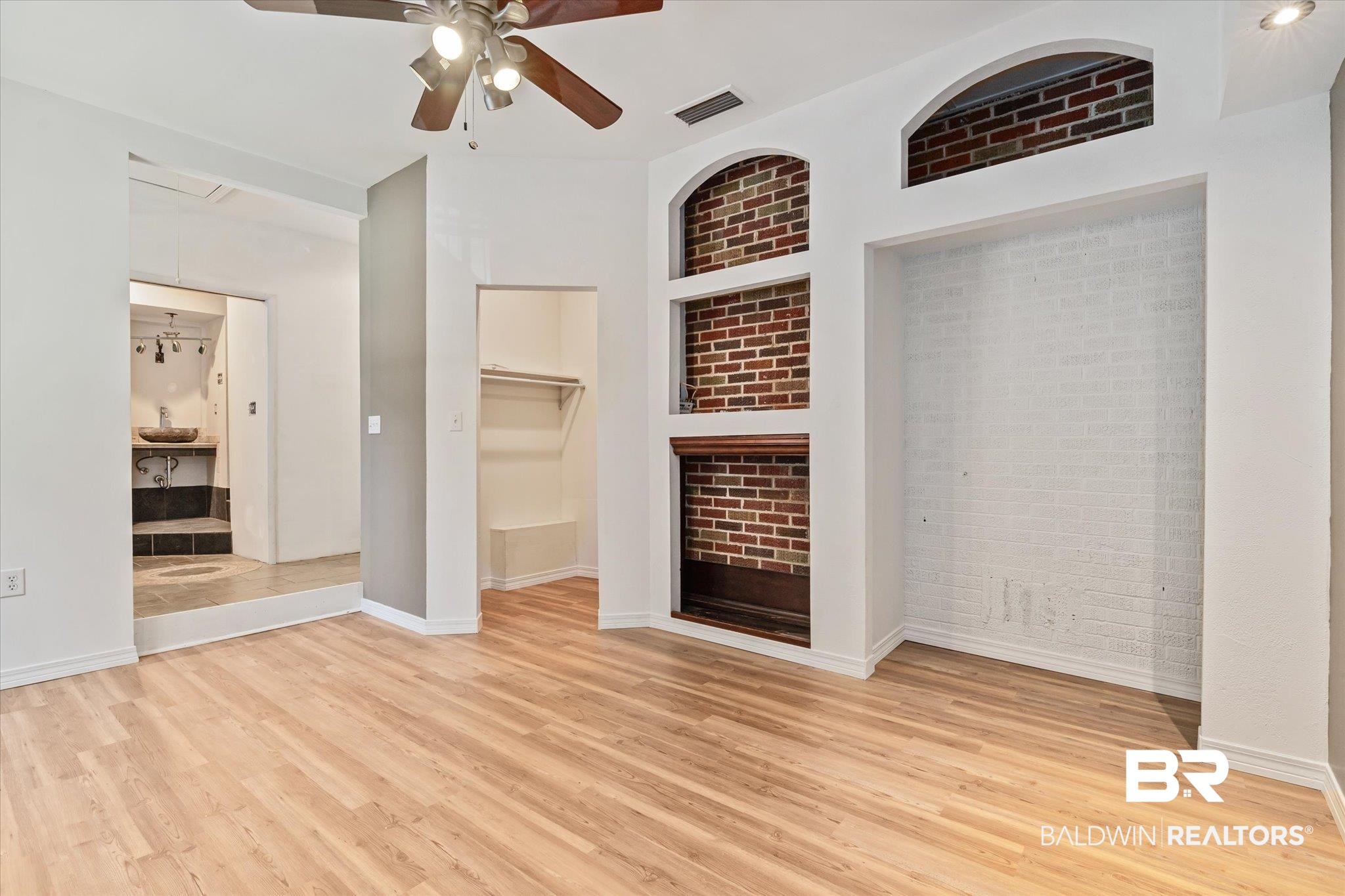 3325 Lacoste Road Mobile, AL 36618 - Photo 9 of 35 Unfurnished living room featuring ceiling fan and light wood-type flooring