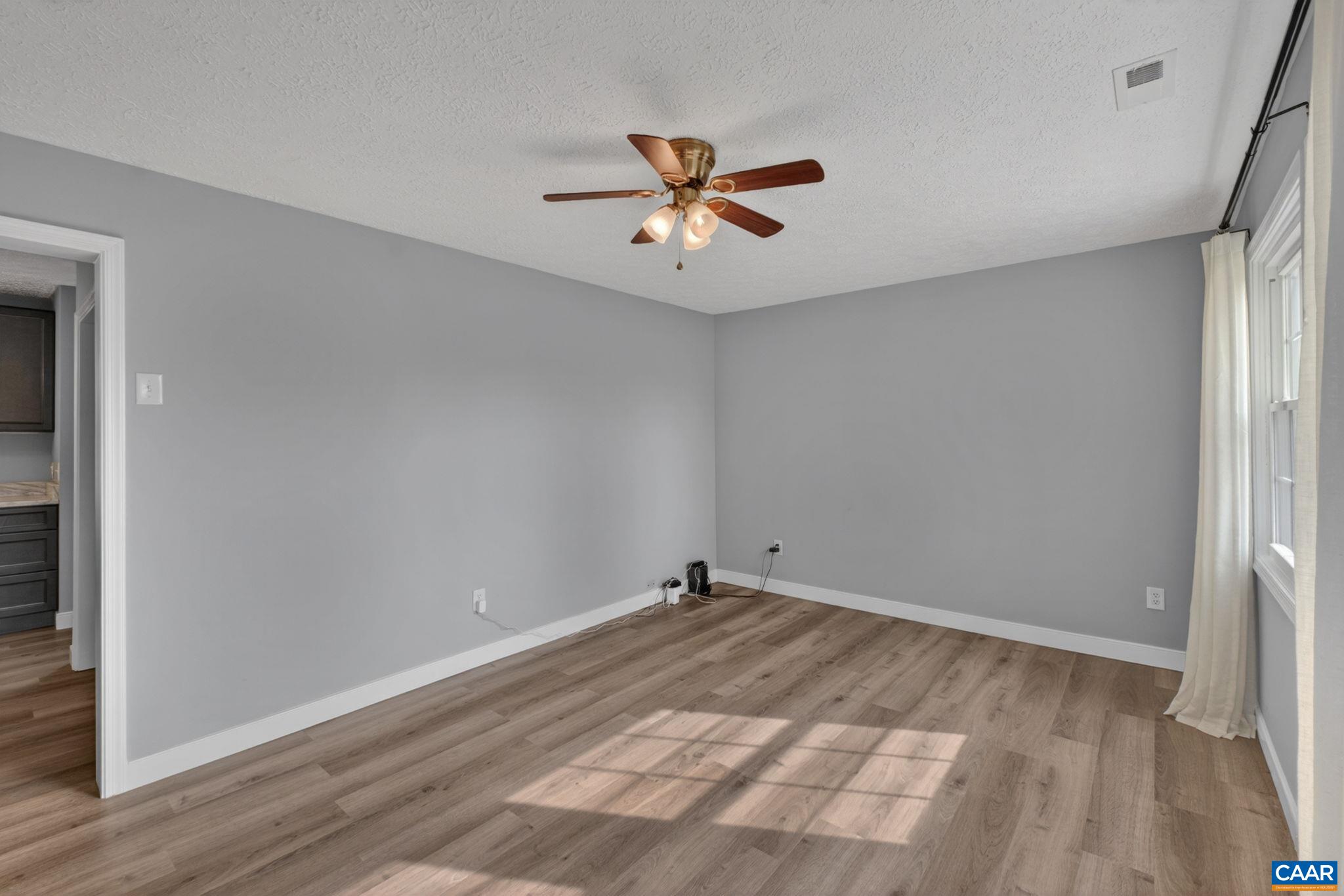 673 Cedar Lane Road Palmyra, VA 22963 - Photo 10 of 47 wooden floor in an empty room with a window