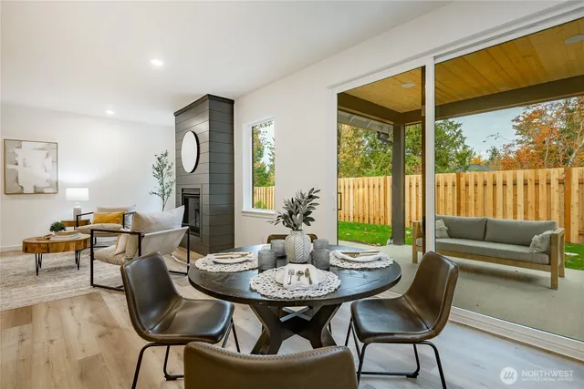 a view of a dining room with furniture window and outside view