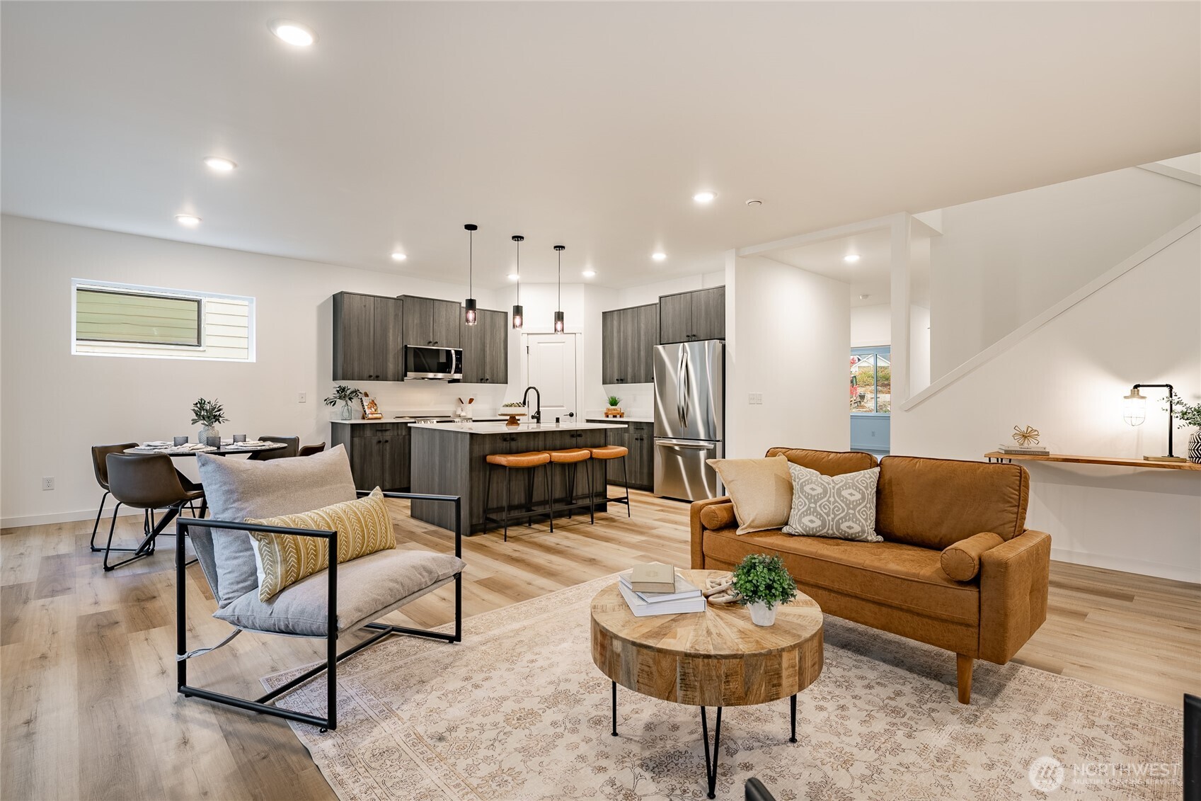 2992 Cedar View Road Blaine, WA 98230 - Photo 15 of 39 a living room with furniture kitchen view and a wooden floor
