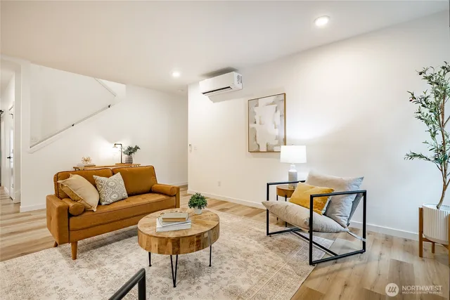 a living room with furniture and a rug